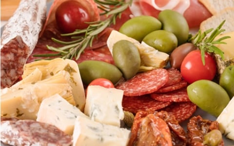 Image of a Charcutier platter with a selection of olives, cheeses and small goods