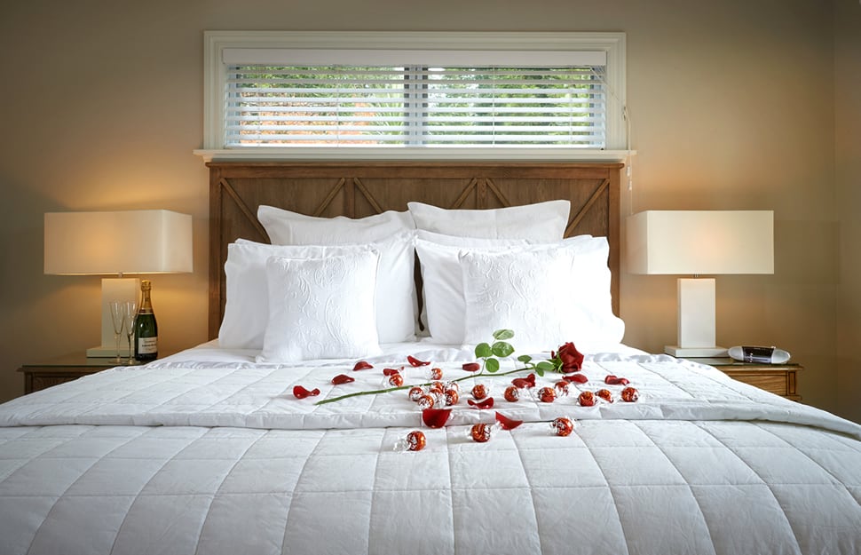 Treghan Owner's Cottage bedroom with roses - romantic setting