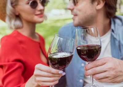 Image of a man and women enjoying a glass of red wine