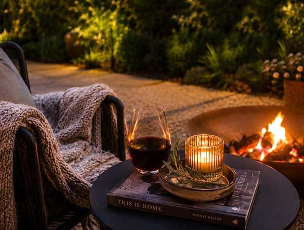 Cozy evening beside the firepit at Treghan Lodge with local wine, candlelight and peaceful garden surroundings in Kerikeri, Bay of Islands Cozy evening beside the firepit at Treghan Lodge with local wine, candlelight and peaceful garden surroundings in Kerikeri, Bay of Islands