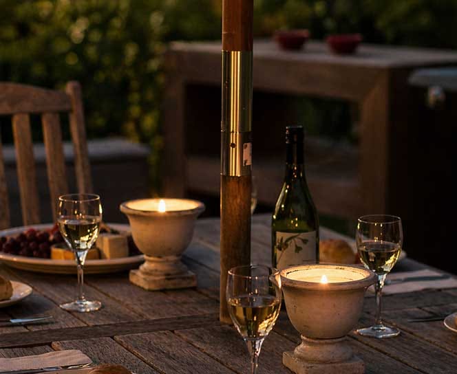 Evening wine and outdoor dining at Treghan Lodge in Kerikeri, Bay of Islands, with candlelight and peaceful garden surroundings Evening wine and outdoor dining at Treghan Lodge in Kerikeri, Bay of Islands, with candlelight and peaceful garden surroundings