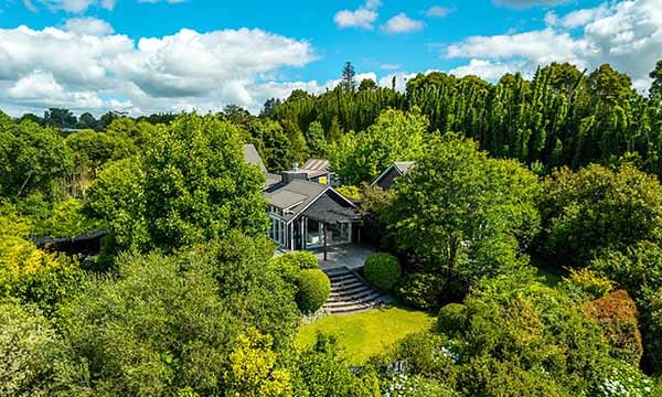 Treghan Lodge aerial view showing private guesthouses, landscaped gardens and native bush near Kerikeri in the Bay of Islands.