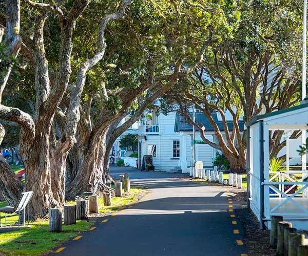 Tree-lined street in Russell, Bay of Islands, perfect for exploring the village on foot. Tree-lined street in Russell, Bay of Islands, perfect for exploring the village on foot.